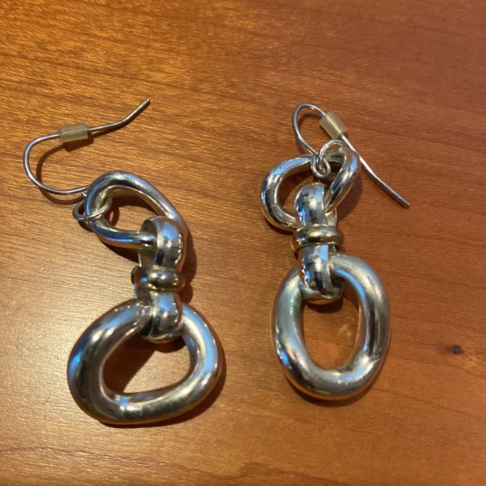 10 pairs of silver tone earrings